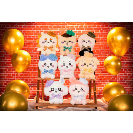 Group of sitting plush toys in white with blue, pink, and green details