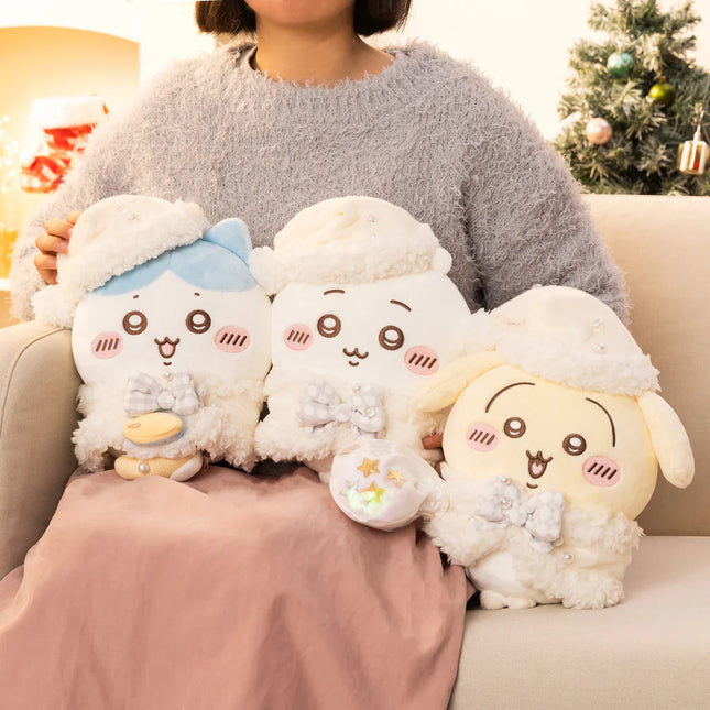Cute white plush character with closed eyes and blue cap detail, held in arms.