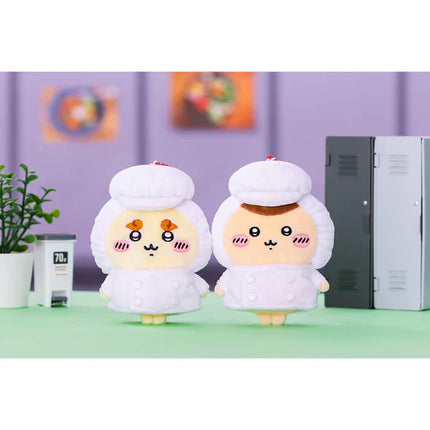 Two plush chef mascots with white chef jackets and bead keychains, standing side by side