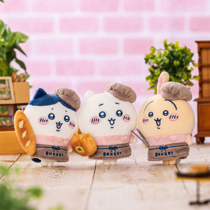 Bakery staff mascot plush set of three: blue, white, and cream characters with hats