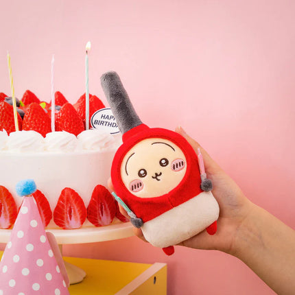 Red-and-white birthday plush mascot with tall gray hat and beaded “HAPPY BIRTHDAY” topper