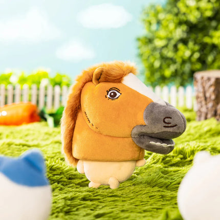 Plush horse-costume mascot standing with orange mane and gray muzzle on green grass