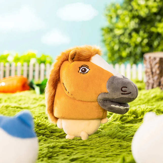 Plush horse-costume mascot standing with orange mane and gray muzzle on green grass