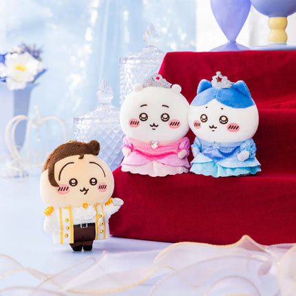 White plush mascot keychain with pink ruffled dress and bead crown.