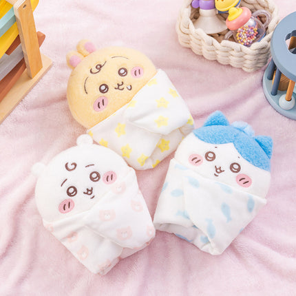 Baby swaddle plush set with yellow, white, and blue character faces