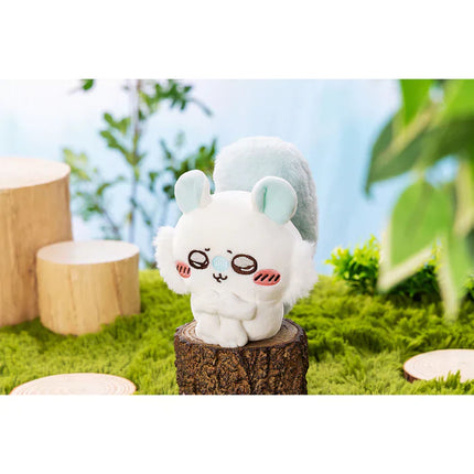 Chiikawa plush toy standing with sad face, light-blue ears and rounded body