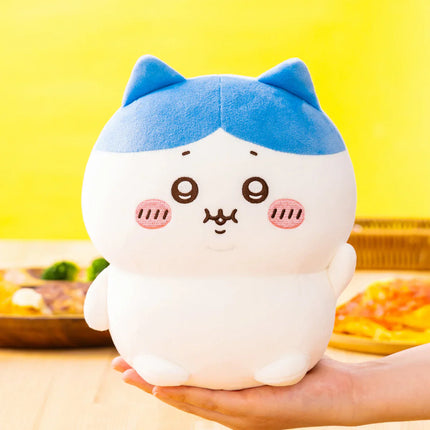 Hand-sized blue cat-themed plush with round face, blush cheeks, and small paws