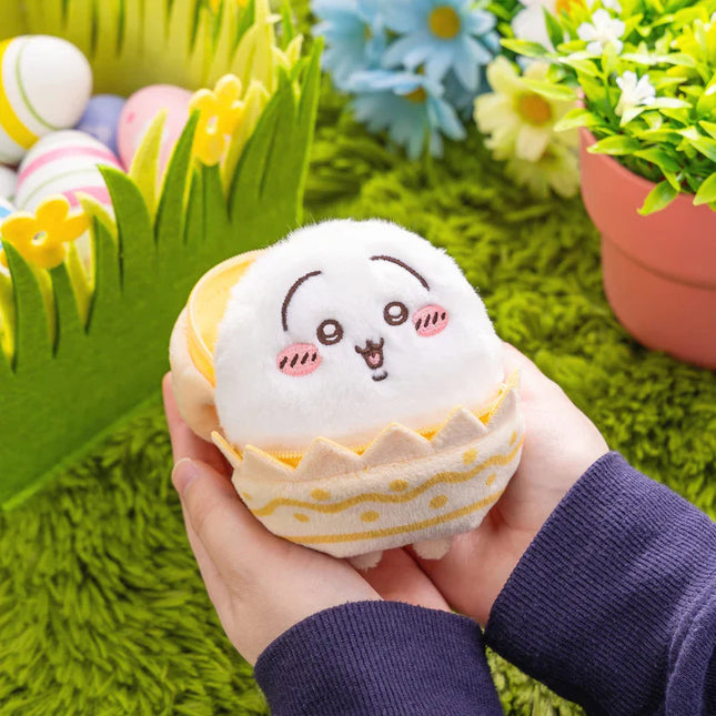 Rabbit Easter mascot plush with a yellow egg shell outfit, held in a hand