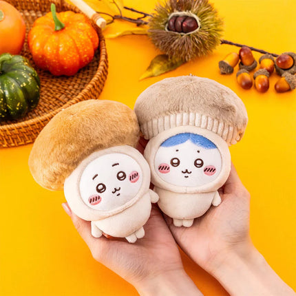 Two small seasonal plush keychains with beige winter hats and cute face embroidery
