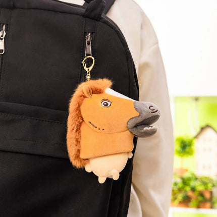 Plush horse-costume mascot keychain with orange mane and gray muzzle on black bag