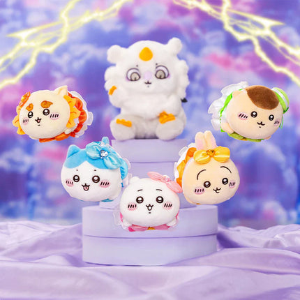 Assorted plush mini mascots with bows and embroidered faces on tiered stands.