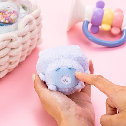 Light blue Chiikawa plush mascot with a sleepy face, soft fabric, held in hands